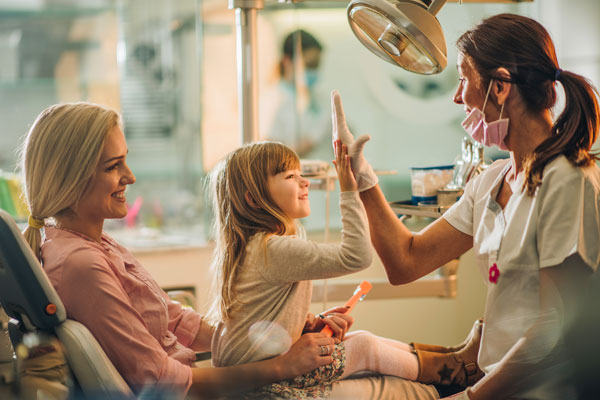 When should kids see an orthodontist? Timing and costs for families
